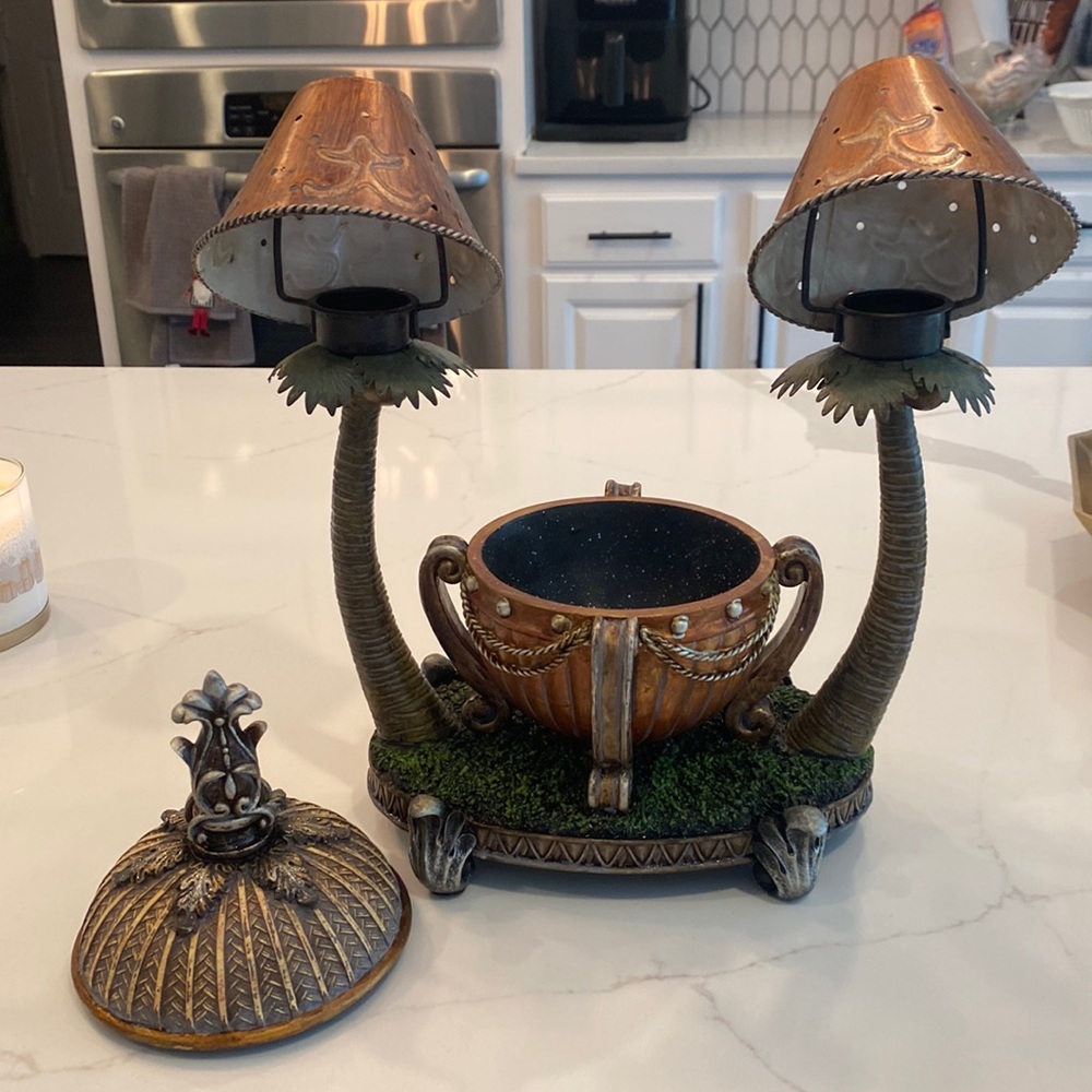 Tea light candle holder with storage